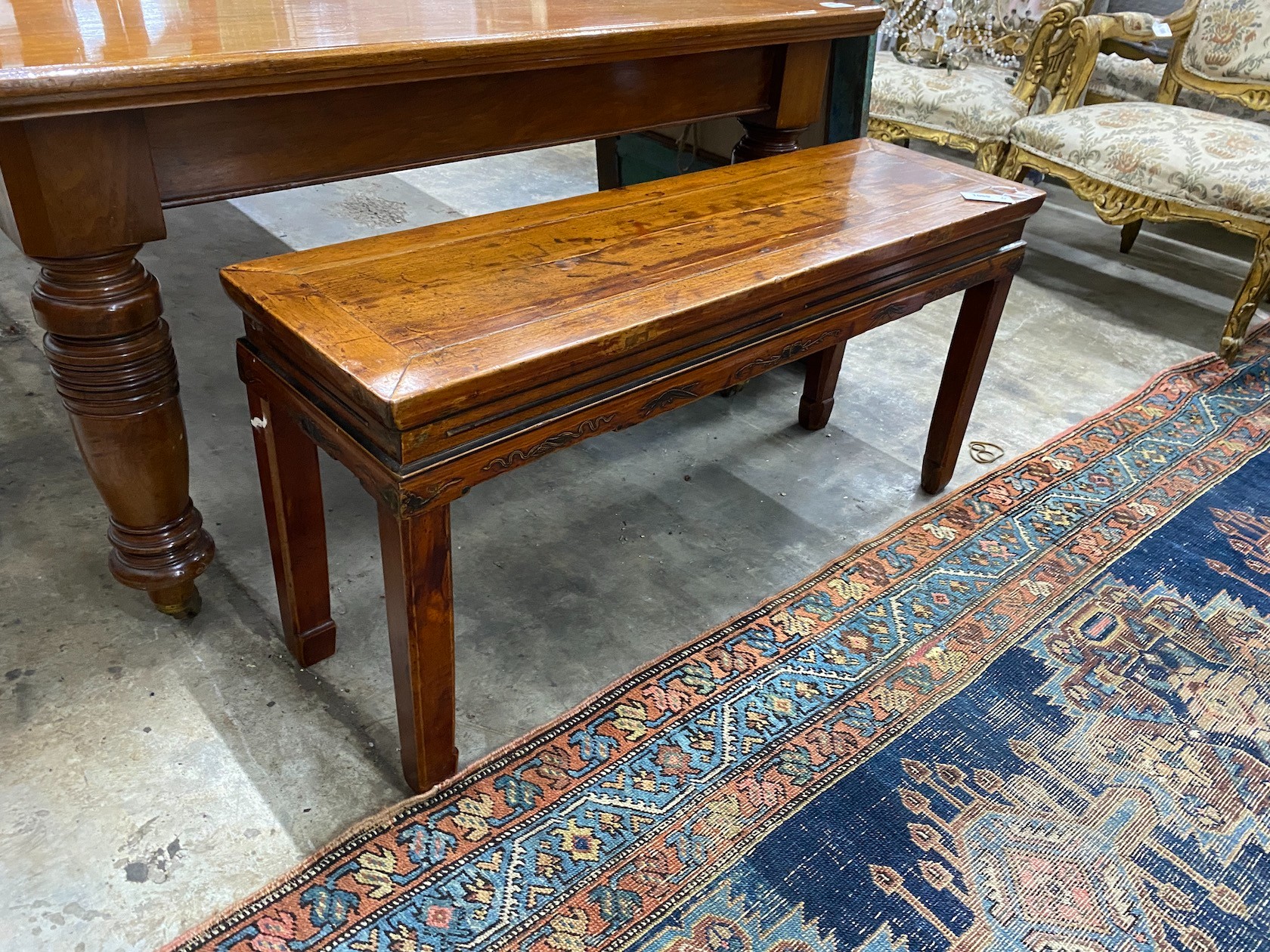 A Chinese elm bench seat, width 111cm
